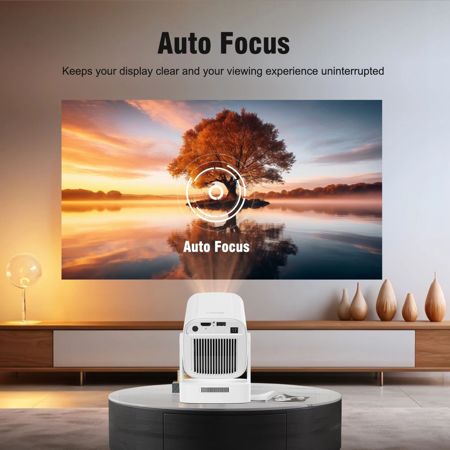 Projector displaying a scenic image with 'Auto Focus' text in a living room setting.